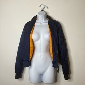 Navy blue bomber/flight jacket with orange lining